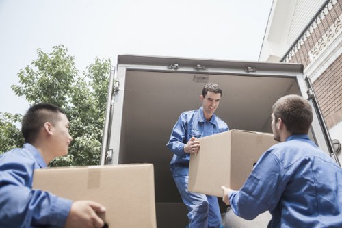 Professional movers loading household items safely